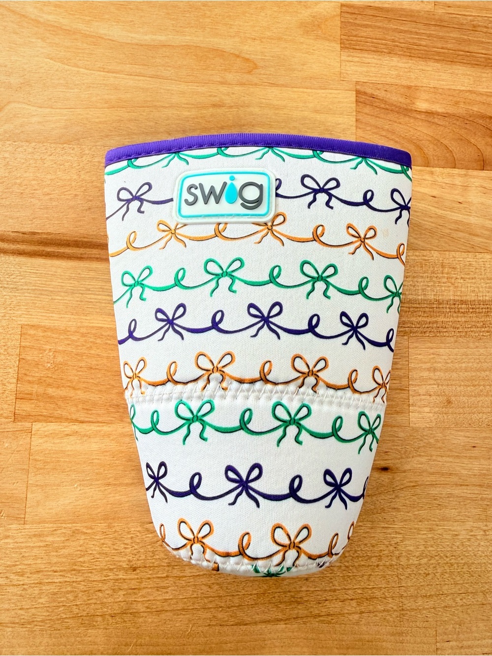 Swig Neoprene Cup Cooler Sleeve with Colorful Mardi Gras Bow Pattern